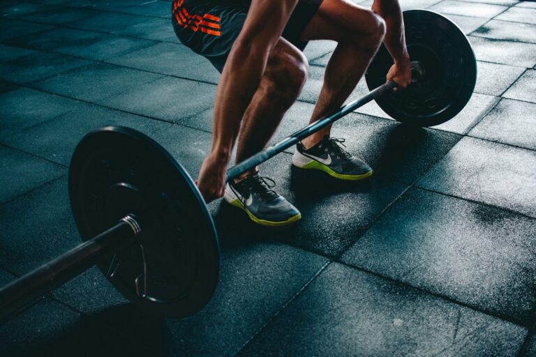 Athlete preparing for a barbell lift during hybrid training