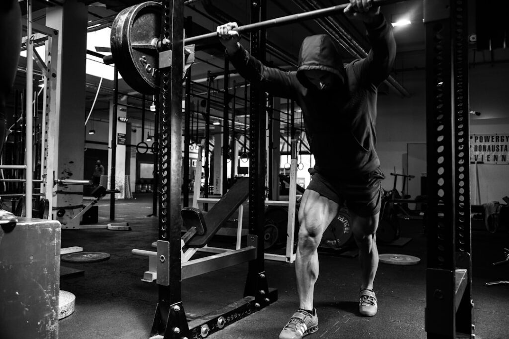 Athlete performing a pull-up during stunt conditioning