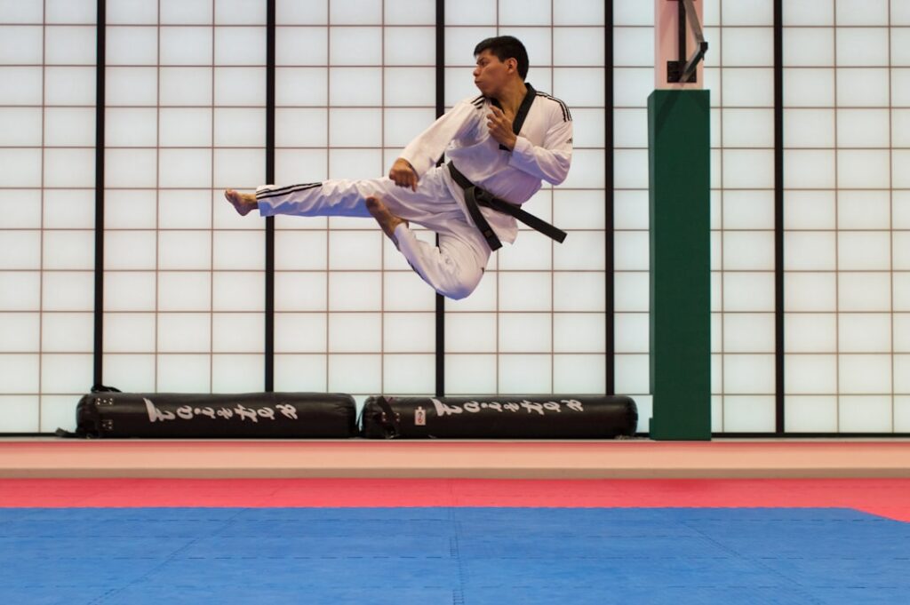 Martial artist training in a gym for action performance